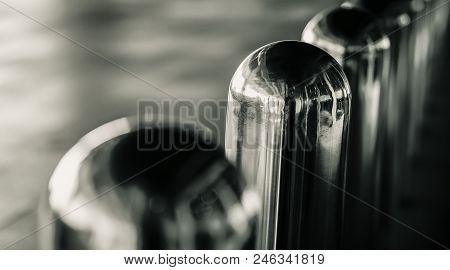 Close-up Stainless Steel Bollard Barriers On Blurred Background. Stainless Steel Pole Prevent People