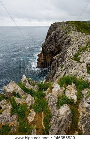 Coastal cliffs near of the beach Gulpiyuri, Asturias, Spain