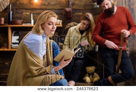 Dreamy Female Reading Fascinating Book, Fantasy World Concept. Woman In Blue Shirt, Jeans And Beige 
