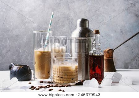 Iced Coffee Cocktail Or Frappe With Ice Cubes And Cream In Different Glasses With Jezva, Silver Shak