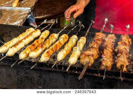 Cooking Meat On Open Fire, Lyulya-kebab National Eastern Cuisine Is Meat In A Dough Over An Open Fir