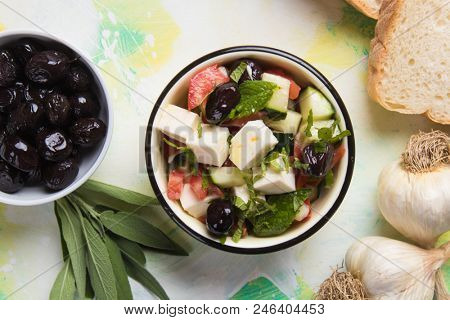 Greek salad with feta cheese cubes and fresk vegetables