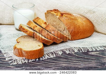 Still Life With Slices Of Bread On A Wooden Background