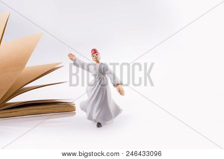 Sufi Dervish On A Notebook On White Background