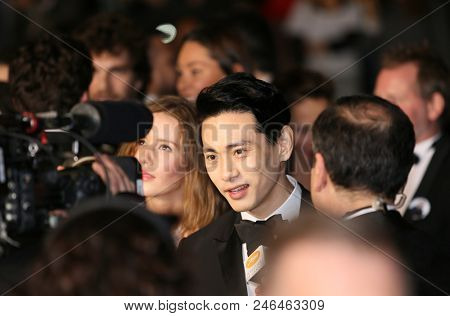 Irina Starshenbaum, Teo Yoo, with a sign to free Director Kirill Serebrennikov attend the screening of'Leto' during the 71st annual Cannes Film Festival at Palais on May 9, 2018 in Cannes, France. 