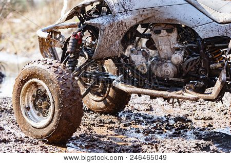 Close-up Of Dirty Atv Suspension And Angine
