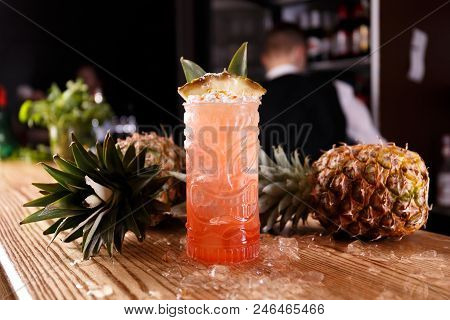 A Red Pina Colada Coctail Is Made Of Ripe Pineapples And Decorated With Cubed Ice.