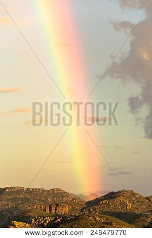 Rainbow After Monsoon Thunderstorm In Arizona With Mountains