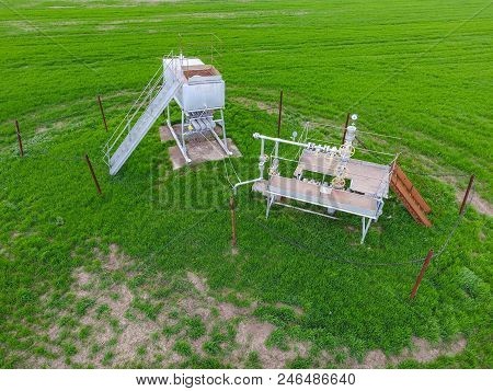 A Tank With Methanol Near The Oil Well. Equipment Of An Oil Well. Shutoff Valves And Service Equipme