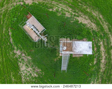 A Tank With Methanol Near The Oil Well. Equipment Of An Oil Well. Shutoff Valves And Service Equipme