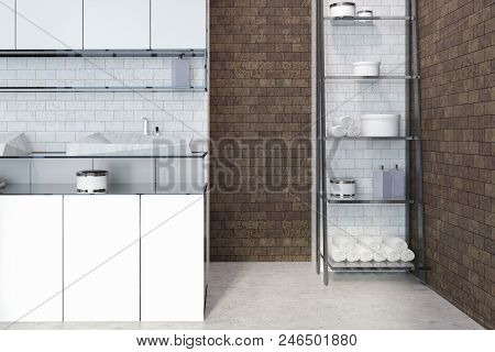 Sink Standing On White Countertops In A White And Brick Bathroom Interior. Shelves To The Rigth. 3d 