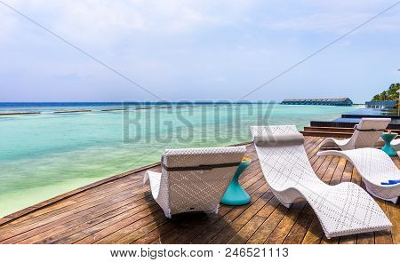 Deckchair And Beautiful Turquoise Indian Ocean In Maldives