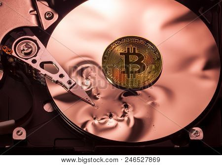 Bitcoin Superimposed On The Damaged Discs Of A Hard Drive Storage To Illustrate Bitcoin Market Crash