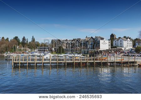 South Lakeland, Uk - April 2018: Bowness Pier With Boats For Hire And Tourist Cruises At Bowness-on-