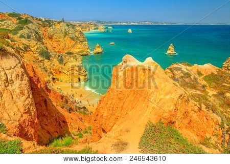 Scenic Aerial View Of Praia Do Camilo And Lagos Coastline In Algarve, Portugal, Europe. Turquoise Wa