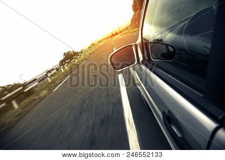 A Car Driving On A Motorway At High Speeds