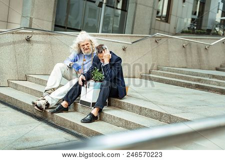 Kind Support. Kind-hearted Inspired Strangely Looking Street Person Coming For Supporting Sad Just F
