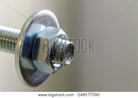 Stainless Steel Bolts And Nuts On A White Background. Bolt, Washer And Nut On A White Background. Bo