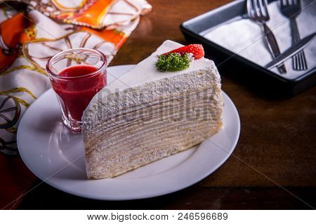 Strawberry Crape Cake On Wood Table In Coffee Shop , Dessert Tasy Cake