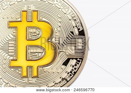 Close Up Of Golden Bitcoin On White Background. High Resolution Photo.