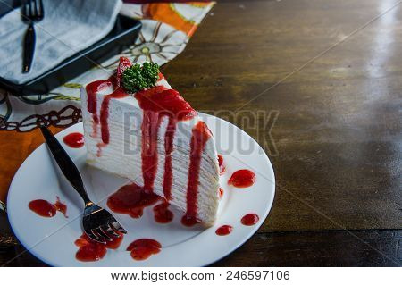 Strawberry Crape Cake On Wood Table In Coffee Shop , Dessert Tasy Cake