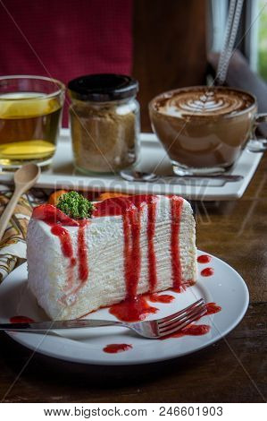 Strawberry Crape Cake On Wood Table In Coffee Shop , Dessert Tasy Cake