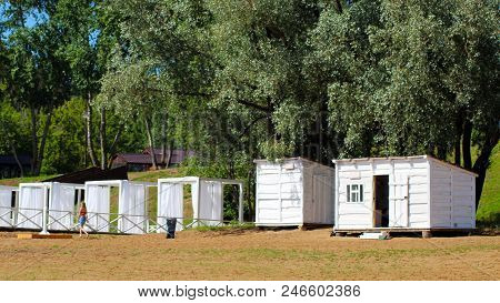 Beautiful Small Bathing Houses On Yellow Sandy Beach
