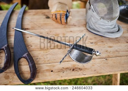Medieval Weapons On A Wooden Table For Any Purpose