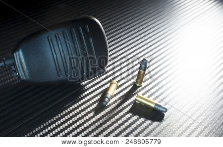 Three Rim Fire Bullets With A Police Type Of Microphone