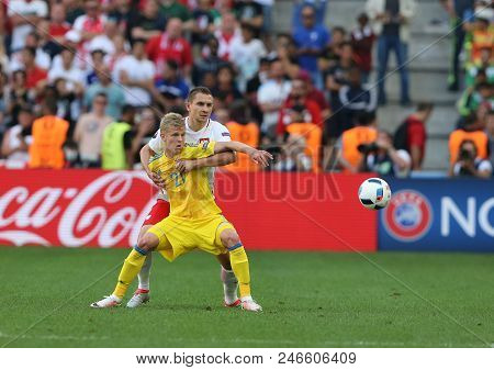 Marseille, France - June 21, 2016: Olexandr Zinchenko Of Ukraine (yellow) Fights For A Ball With Art