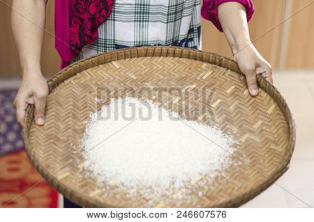 Housewife Winnowing Rice By Using Bamboo Basketwork For Separate Between Rice And Rice Husk.selectiv