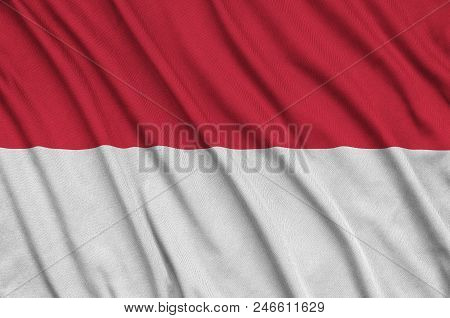 Indonesia Flag  Is Depicted On A Sports Cloth Fabric With Many Folds. Sport Team Waving Banner
