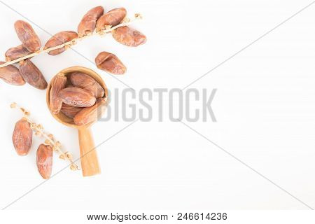 Dates Fruit In Wooden Ladle On White Background,dried Date Palm Fruits Top View