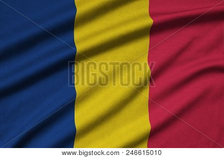 Chad Flag  Is Depicted On A Sports Cloth Fabric With Many Folds. Sport Team Waving Banner
