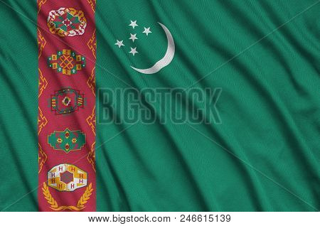 Turkmenistan Flag  Is Depicted On A Sports Cloth Fabric With Many Folds. Sport Team Waving Banner