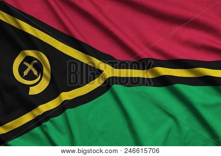 Vanuatu Flag  Is Depicted On A Sports Cloth Fabric With Many Folds. Sport Team Waving Banner