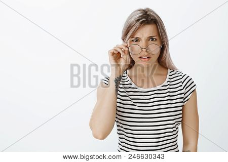 What Are You Talking About. Portrait Of Unsure Confused Attractive Blonde, Taking Off Glasses And Fr