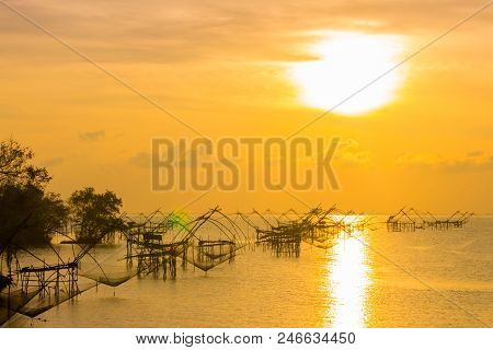 Golden Sky Above Fishing Trap In Pak Pra Talay Noi Sea Phatthalung South Of Thailand