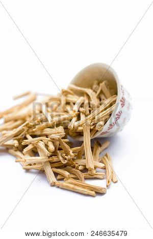 Close Up Of Ayurvedic Herb  Satavari Or Kurilo Or Asparagus Racemosus Isolated On White In A Glass B