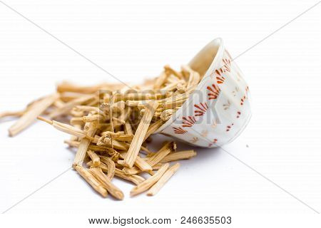 Close Up Of Ayurvedic Herb  Satavari Or Kurilo Or Asparagus Racemosus Isolated On White In A Glass B