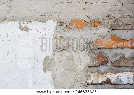 Brick Wall With Cement Mortar And Parts Of Plaster