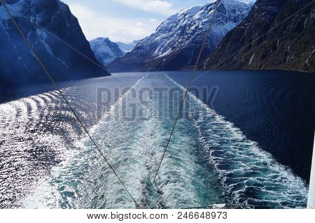 With A Cruise Ship In The Fjords Of Norway