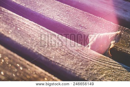 Close Up Of Dry Leaf, Light Leaks And Wooden Planks Covered With Sparkling Hoar Frost In Free Lensin