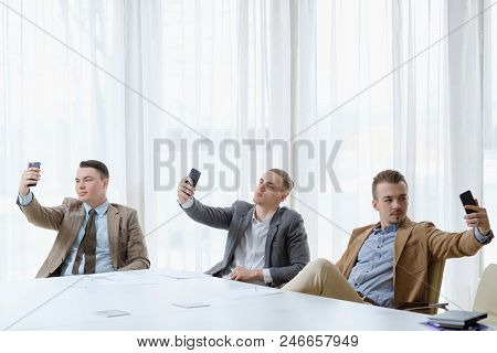 Selfie Addiction And Inflated Ego. Successful Business Men Taking Photos Of Themselves. Self-absorpt