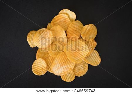 Potato Chips. Delicious Beer Chaser. Best Food For Quick Snack. Crunchy Spicy Crisps On Dark Backgro