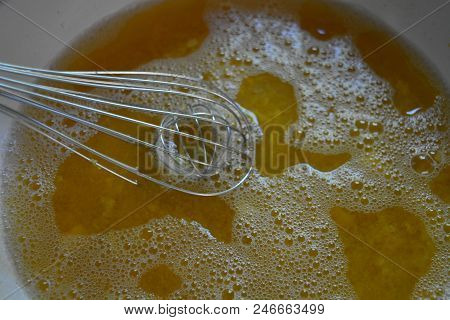 Metal Kitchen Whisk In A Fruit Apricot Broth, A Kampot From Fresh Apricot For Fruit Jelly.