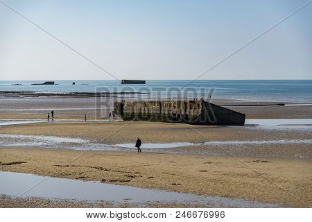 The Remains Of The Mulberry Harbour At Arromanches, Normandy France