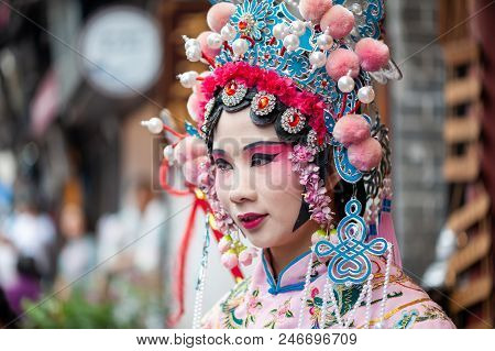 Chongqing, China - June 13, 2018 : Woman With Chinese Opera Traditional Dress And Make-up In Ciqikou