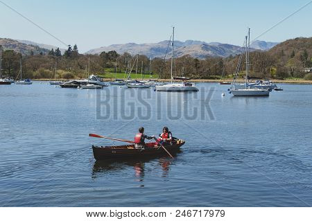 South Lakeland, Uk - April 2018: Tourists Rowing Boat On Scenic Lake Windermere In Lake District Nat