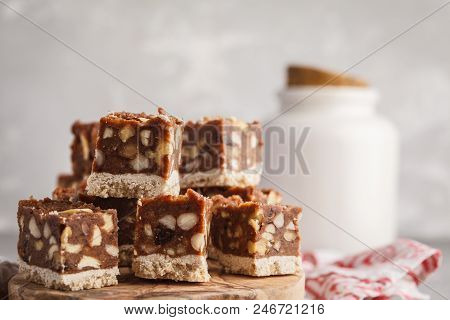 Raw Vegan Dessert With Nuts And Dates. Healthy Lifestyle And Raw Vegan Dessert Concept